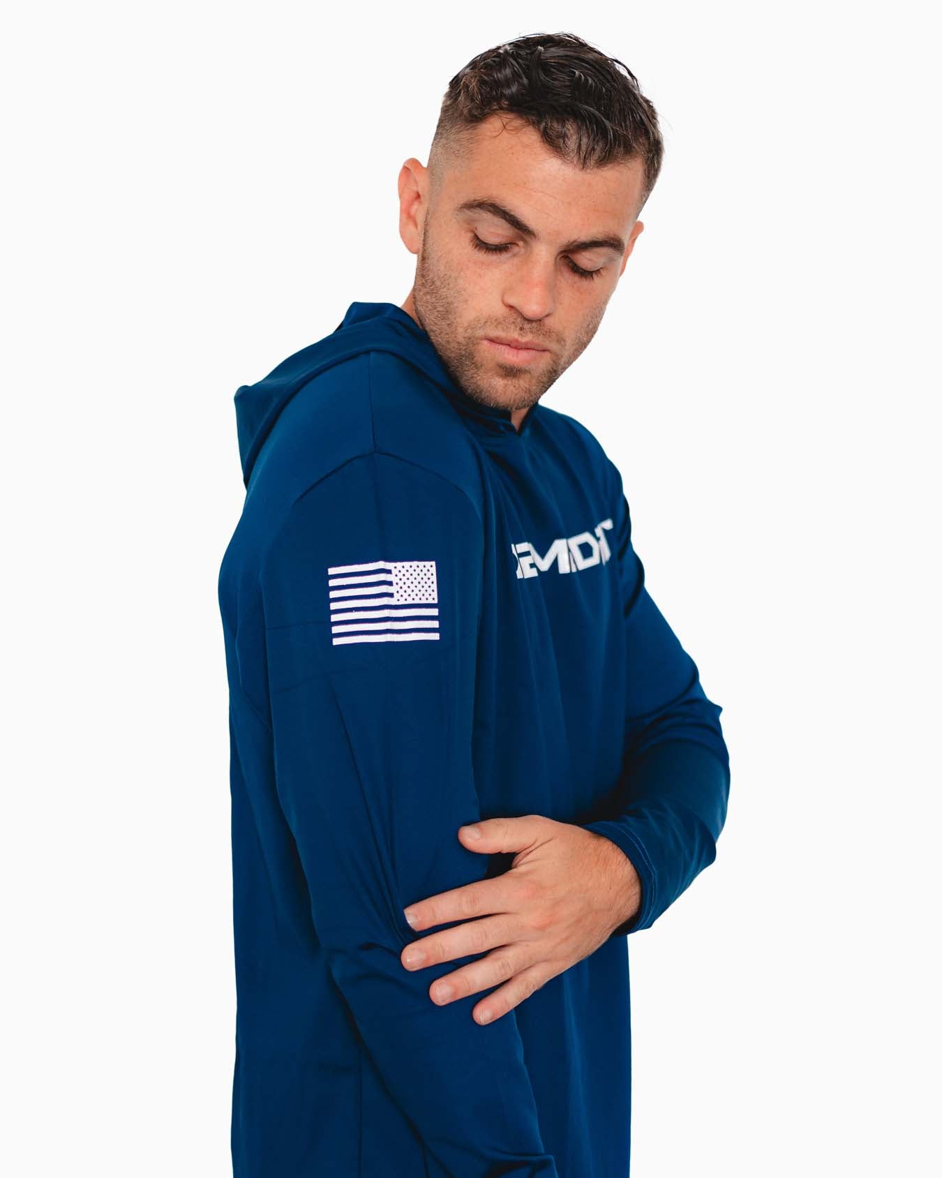 Model adjusting the hood, showcasing flexible material.