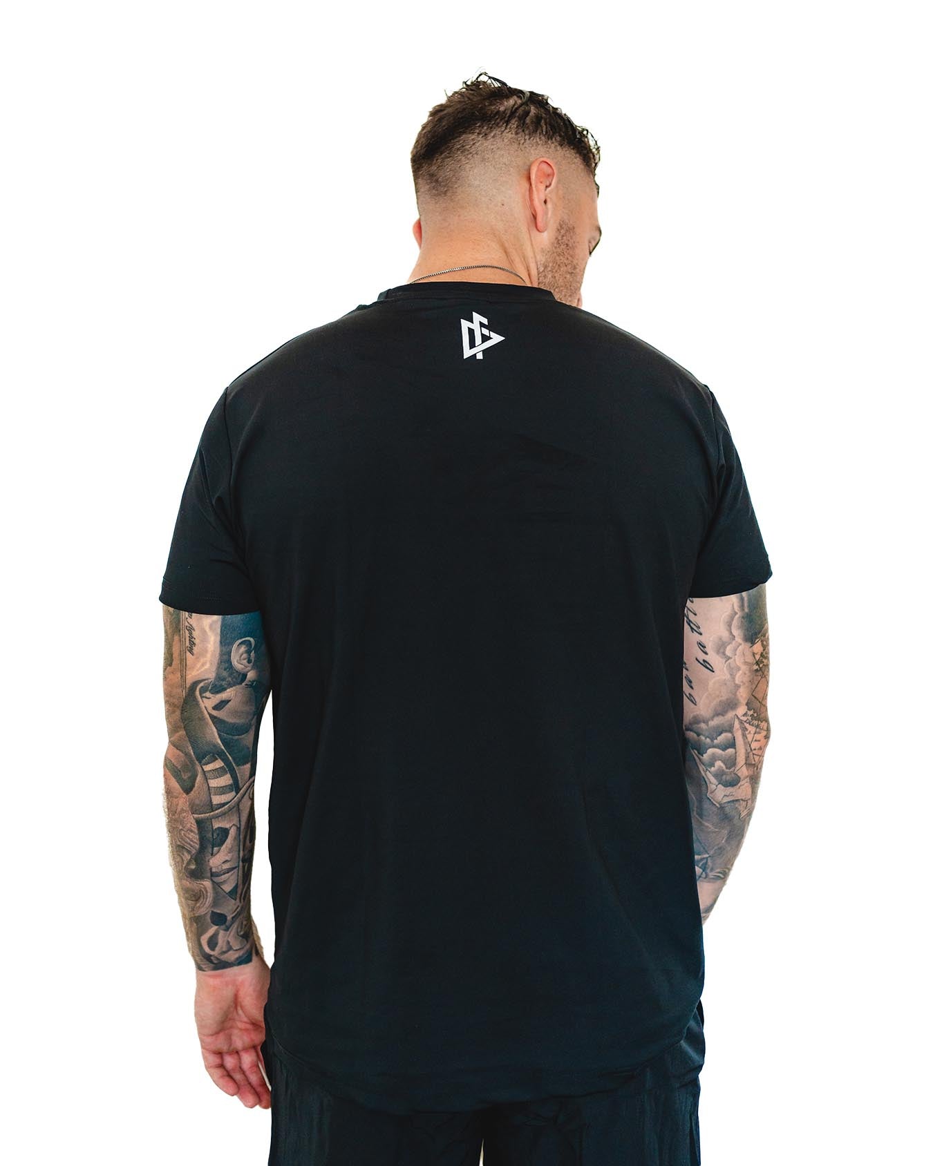back profile of the Compellence tee showing athletic fit and sleeve design