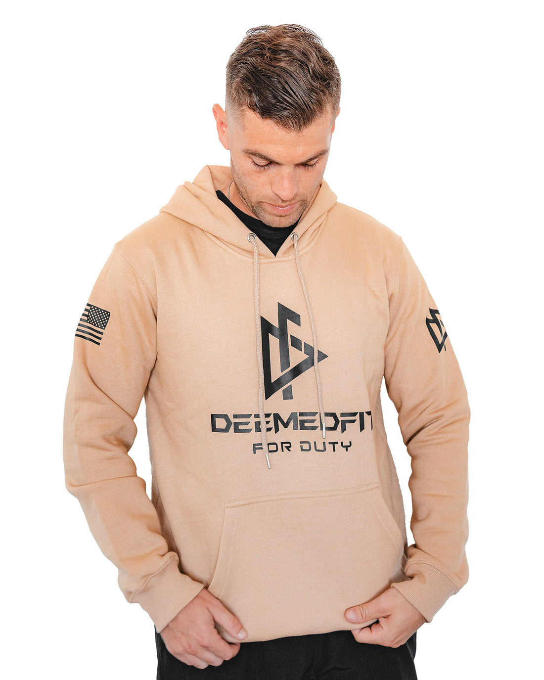 A tan-colored hoodie with front pockets, featuring the text 'DEEMEDFIT' and 'FOR GTAV' on the front, and an American flag on the left sleeve.