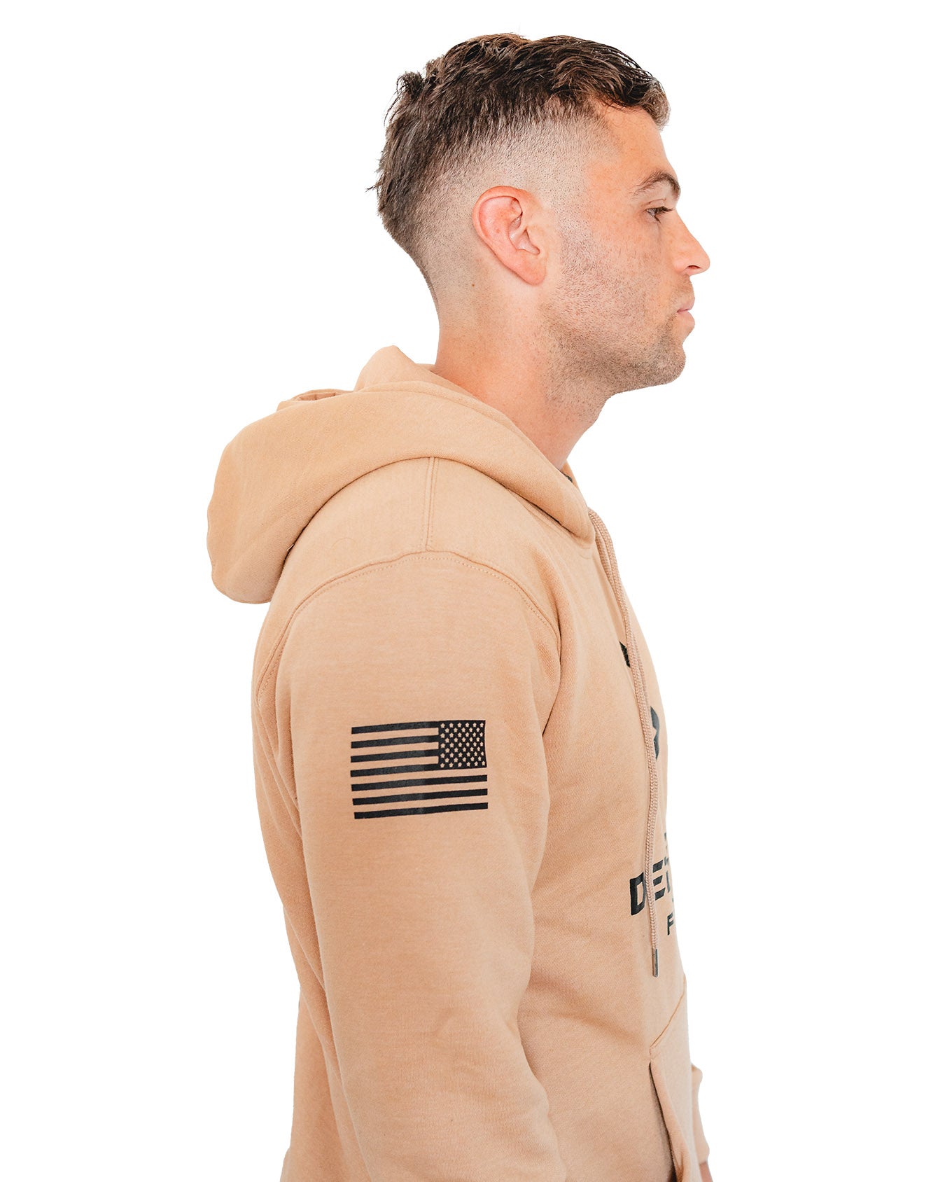 Sideview of a tan-colored hoodie featuring bold 'DEEMEDFIT' branding and a subtle American flag on the sleeve.