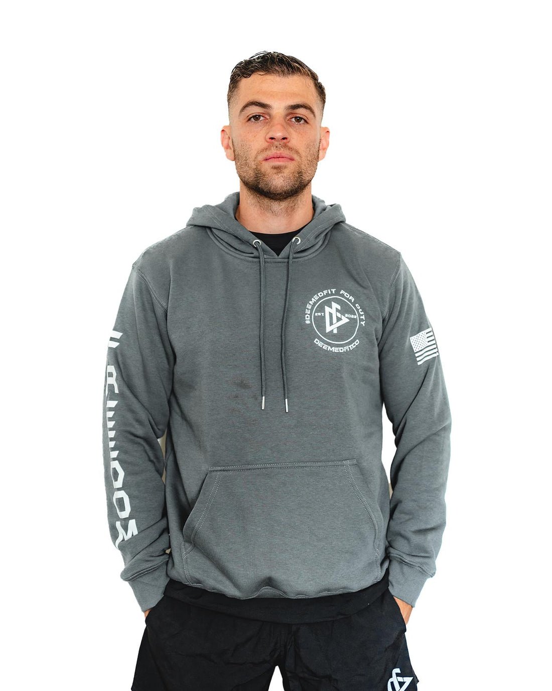 A gray pullover hoodie with 'Freedom' written on the right arm and an American flag on the left arm. The back has a flag design with stripes and stars.