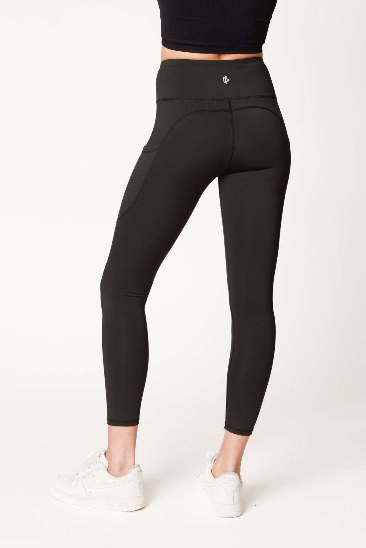 Back view of Pocket Legging- Black | DeemedFit on model.