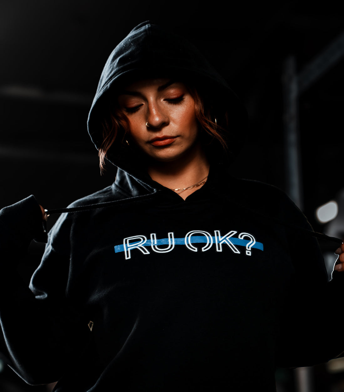 Black hoodie with text and graphics on a white background