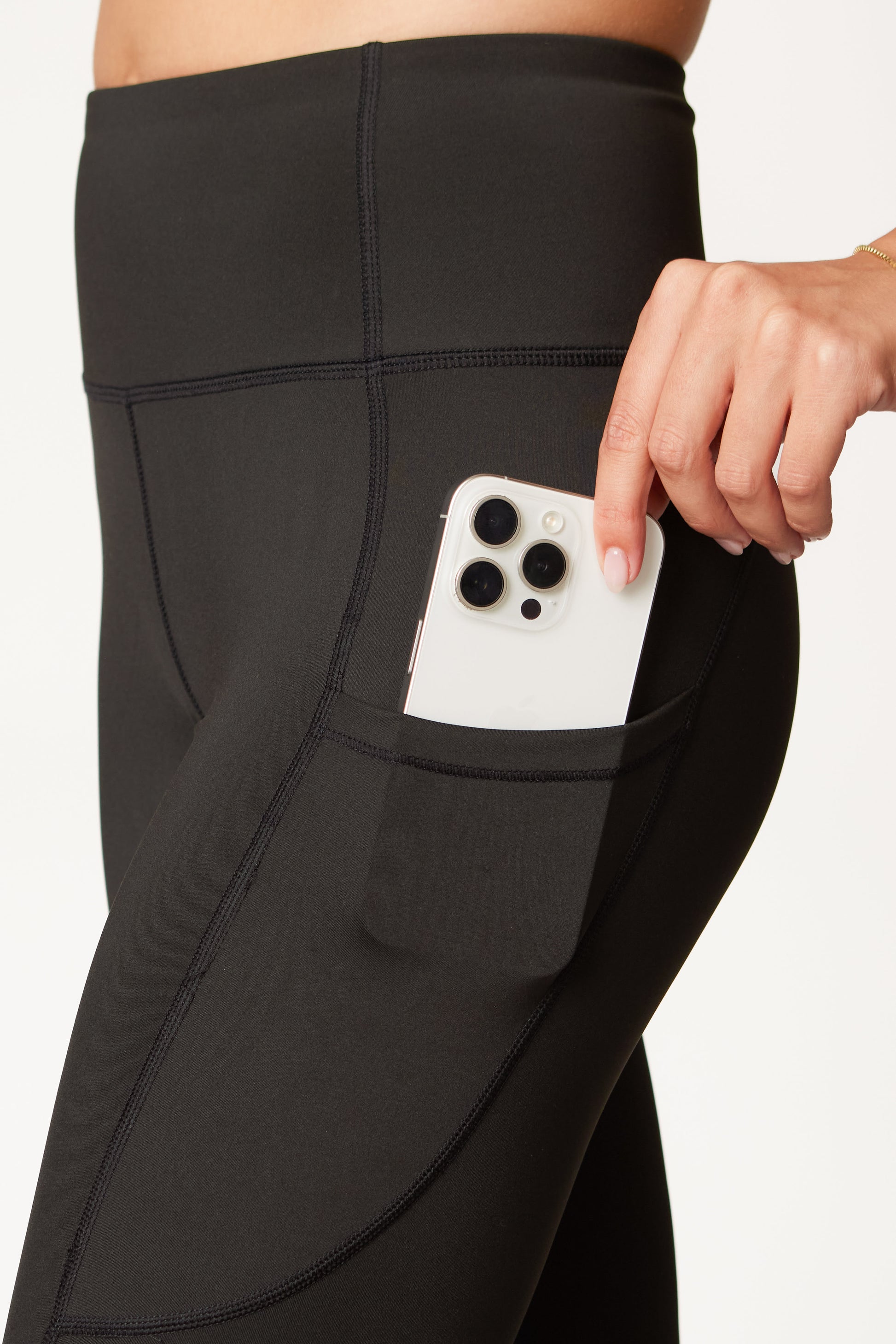 Close-up of stretchy fabric on DeemedFit black leggings.