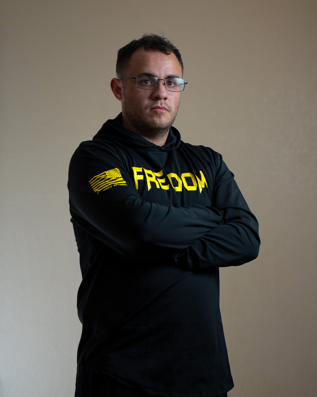 Black long-sleeve shirt with 'FREEDOM' printed in yellow on a white background