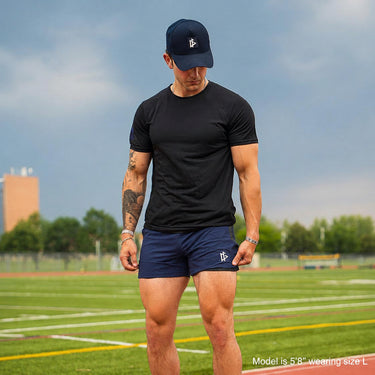 Man wearing Tactical Short in Midnight colorway, lifestyle shot