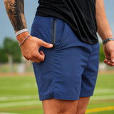 Man wearing Tactical Short in Midnight colorway, full body lifestyle shot