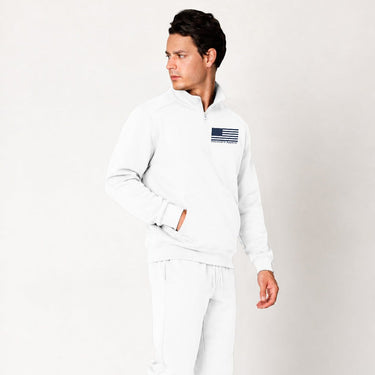 White Blue Line quarter zip pullover worn by a model, angled front view