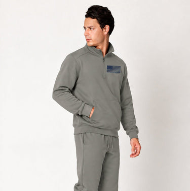 Dark gray Blue Line quarter zip pullover worn by a model, angled front view