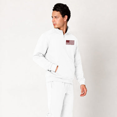 Dark gray Red Line quarter zip pullover worn by a model, angled front view