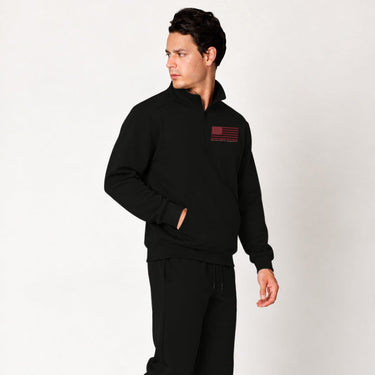 Black Red Line quarter zip pullover worn by a model, angled front view