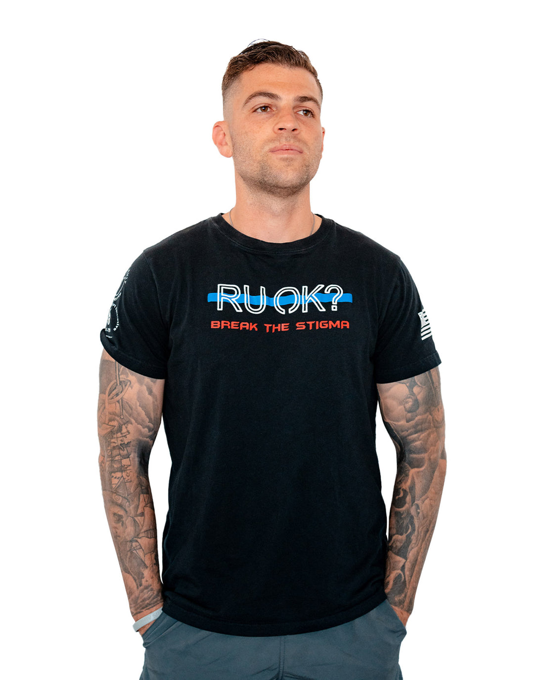 Black t-shirt with 'RUOK?' text and American flag sleeve on a white background