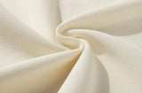 Close-up of beige fabric with folds
