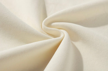Close-up of beige fabric with folds
