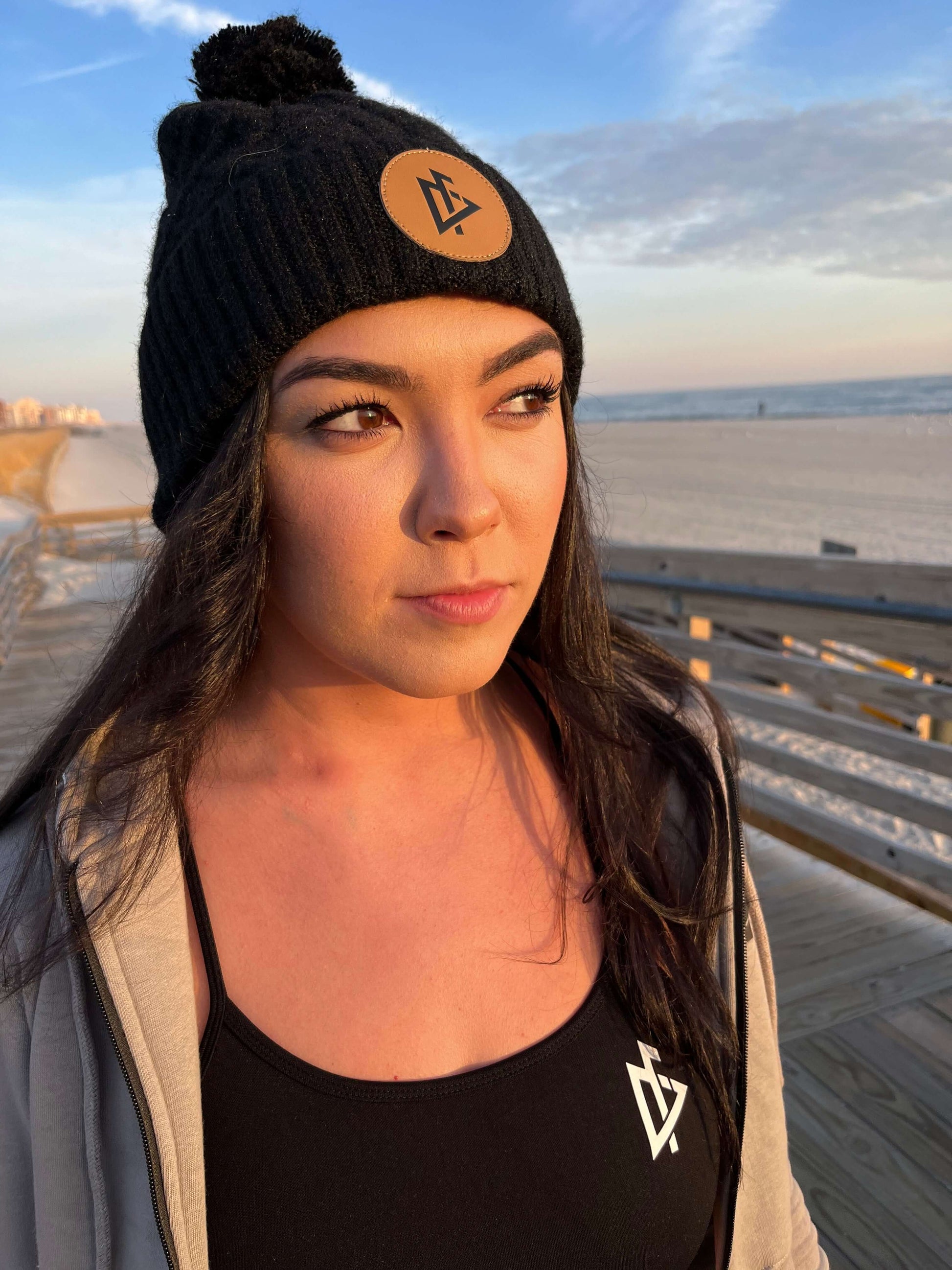 young woman wearing DeemedFit black cotton beanie 